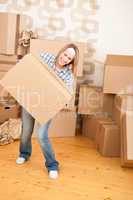 Moving house: Woman holding big carton box