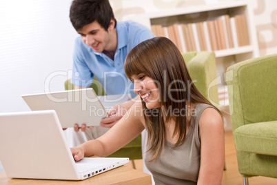 Student - two teenager with laptop in living room