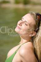 Blond woman in bikini enjoy summer sun