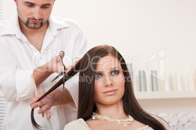 Professional hairdresser cut with scissors at salon