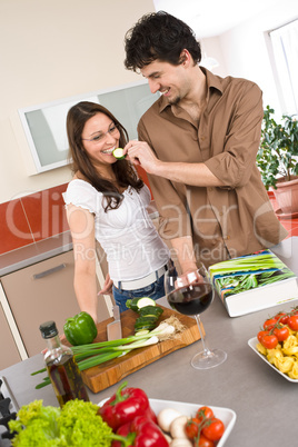 Happy couple cook together in modern kitchen