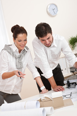 Young man and woman working together Young man and woman working together