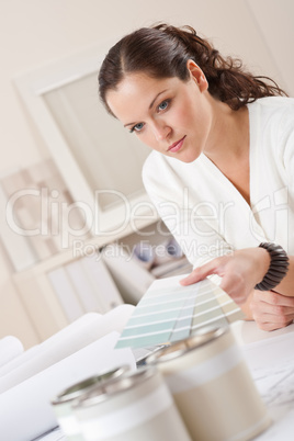 Young female interior designer working at office