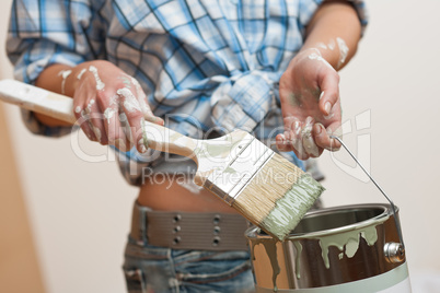 Home improvement: Woman holding paint brush