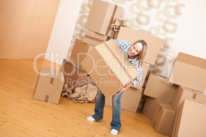 Moving house: Woman holding big carton box