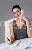 Executive businesswoman on the phone at office