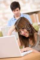 Student - two teenager with laptop in living room