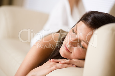 Beautiful woman sleeping on sofa