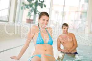 Swimming pool - young beautiful woman relax in bikini