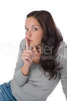 Beautiful woman expressing silence, finger on lips