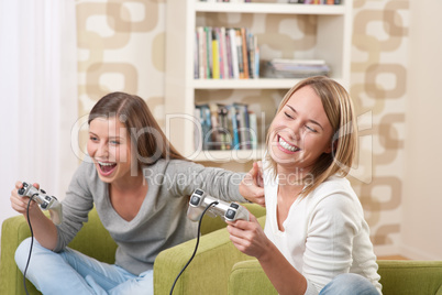 Students - Two female teenager playing video TV game