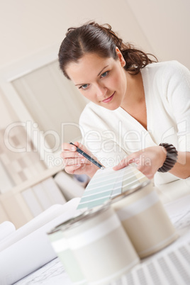 Young female interior designer working at office