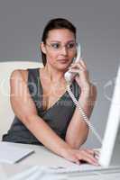 Executive businesswoman calling at office