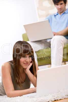 Student - two teenager with laptop in living room