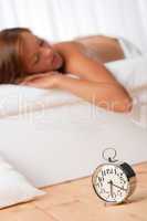 White lounge - Brown hair woman lying in bed