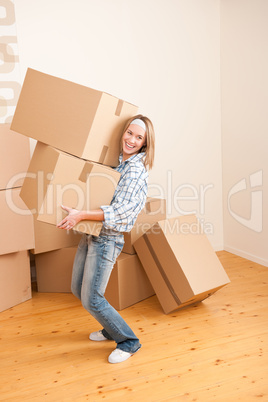 Moving house: Woman holding big carton box