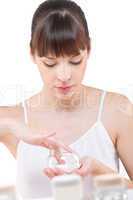 Body care: Young woman with jar of cream