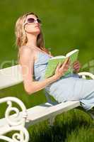 Spring and summer - Young woman relaxing in meadow