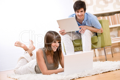 Student - two teenager with laptop in living room