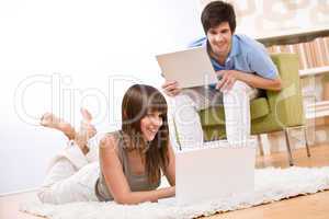 Student - two teenager with laptop in living room