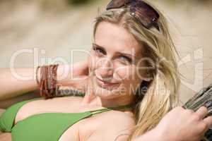 Blond woman in bikini relax on beach