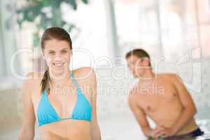 Young happy woman wear bikini relax in spa