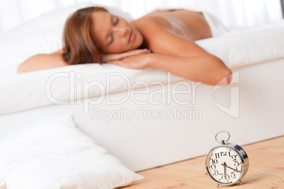 White lounge - Young woman sleeping on white bed