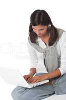 Teenager sitting with laptop