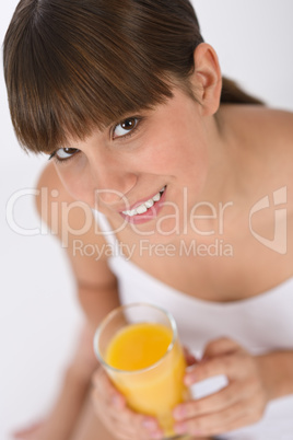 Female teenager with healthy orange juice