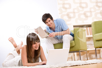 Student - two teenager with laptop in living room