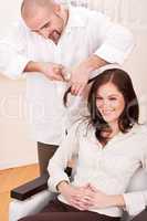 Professional hairdresser cut with scissors at salon