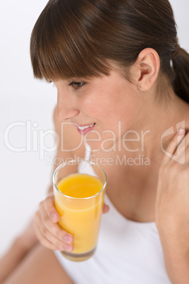 Female teenager with healthy orange juice