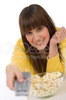 Smiling female teenager watching television