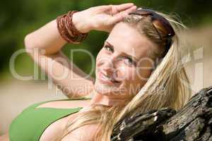 Blond woman in bikini relax on beach