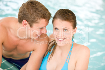 Young loving couple have fun in swimming pool