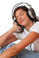 Teenager with closed eyes listening to music