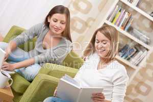 Students - Two teenage girls with laptop and book