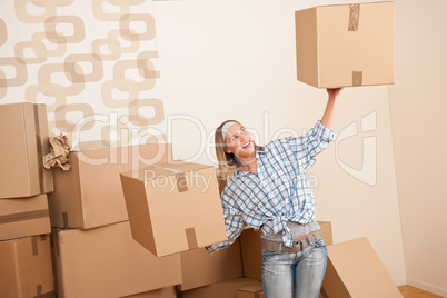 Moving house: Woman holding big carton box