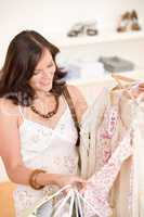 Fashion shopping - Happy woman choose sale clothes