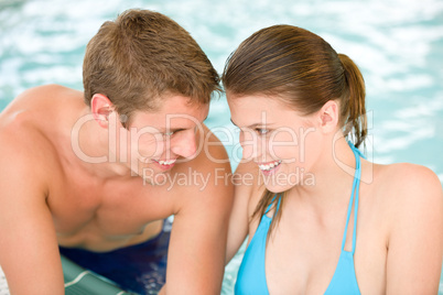 Swimming pool - young loving couple have fun