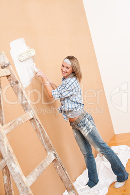 Home improvement: Woman painting wall