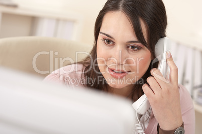 Portrait of young business woman on the phone