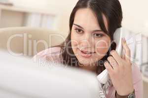 Portrait of young business woman on the phone