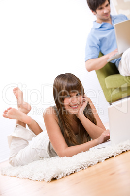 Student - two teenager with laptop in living room