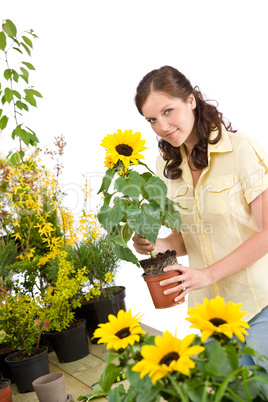Gardening -  woman holding flower pot with sunflower