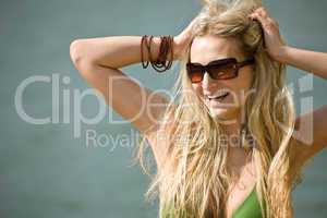 Happy blond woman enjoy holiday at lakeside