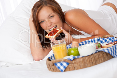 Young woman having home made breakfast
