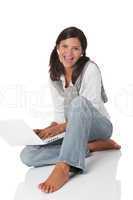 Smiling teenager sitting with laptop