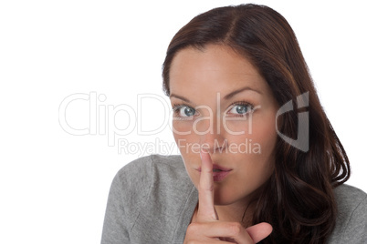 Brown hair woman with  with finger on lips