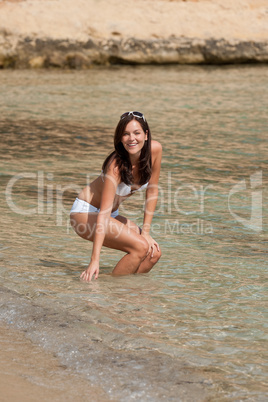 Young woman in bikini in the sea